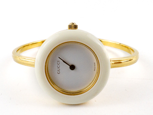 lot 1 image: Ladys Gucci 1112.2 Bangle Quartz Analog watch. Circa 1990  In Original Box With 12 Interchangeable Bezels.