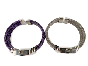 lot 87 image: Ladys Set of two Grey & Purple Faux Leather Open Cuff Band Stainless Steel & Base Metal Quartz Analog watch. Working