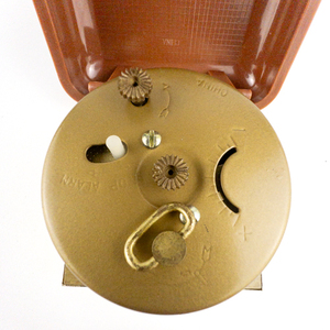 lot 115 image: Westclox Alarm Clock With Hard Case Brown & Yellow Tone Base Metal. Working