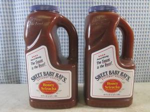 lot 385 image: (B-2) 2 - Half Gallon Sweet Baby Rays Honey Sriracha Wing Sauce & Glaze 64oz (2 QT) Best by Jan 2024