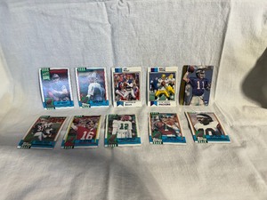 lot 8 image: Collector Football Cards Troy Aikman, Warren Moon, Jim Kelly, Brett Favre, Phil Simms, Joe Montana, Randal Cummingham, John Elway, Ickey Woods