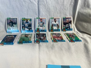 lot 9 image: Collector Football Cards-Tim Brown, Andre Rison, Mark Duper, Mark Clayton, Ozzie Newsom, Jackie Slater, Cris Carter, Don Beebe, John Taylor, Jerry Rice
