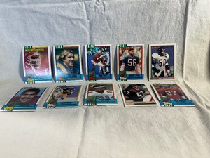 lot 98 image: 10 Football Card Derrick Thomas, Kevin Greene, Adre Tippett, Lawrence Taylor, Mike Singletary, Junior Seau, Rod Woodson, Deion Sanders, Clay Matthews, Steve Atwater