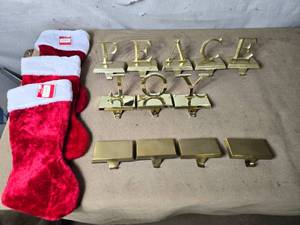 lot 38 image: 12 Christmas Stocking Hangers and 3 Stockings