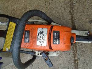 Stihl 16 chainsaw. Runs but may need a little tlc from sitting & handle is broken. As shown.