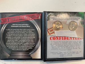 lot 61 image: 2002 P&D Kennedy Half Dollars
