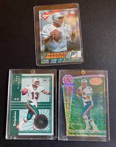 lot 27E image: (3) Dan Marino Numbered Football Cards - 1999 Donruss National Treasures 2000, Chain Reaction 5000, 1994 Collectors Edge #115