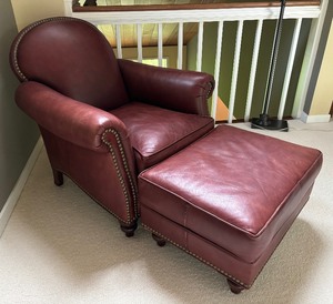 lot 13A image: Distinctive Leather Chair with Ottoman by Statesville Chair Company
