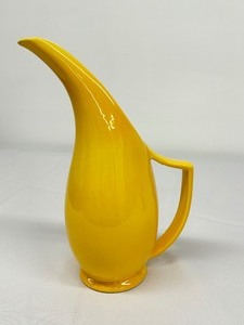 lot 40A image: Curved Yellow Decorative Pitcher