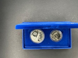 1886-1986 2 PC OMMEN SET - SILVER AND HALF DOLLAR