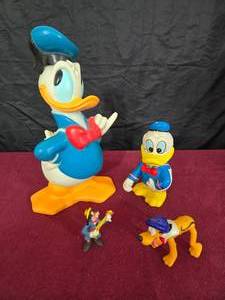lot 25 image: Vintage Disney Donald Duck Bank & Goofy & Pluto