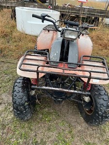 lot 1 image: Red & Gray  Polaris Trail Boss 4x4 as is been in a barn for years sold as is