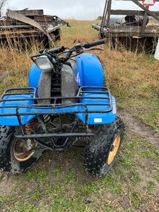 lot 3 image: Blue Polaris Trail Boss 2x4 as is was in a barn for years  no registration sold as is