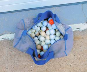 lot 39 image: Bag of Golf Ball, Tees, Small Wiffle Balls in Vintage Dockers Bag