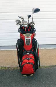 lot 6 image: Set of Tailor Made Flex S ReAx 55 Golf Clubs, Callaway Big Bertha 460 Driver, and Precision Touch and Ping Aner Putters in Sun Mountain C-130 Bag with Cover