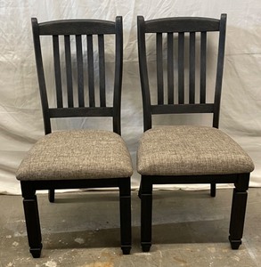 Dining room upholstered slat back chairs.