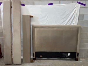 Tan Upholstered Queen bed frame.