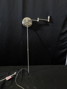 Swing arm wall lamp