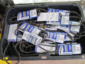 Heavy Duty Storage Tote full of assorted GoodYear Gatorback drive belts
