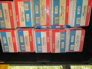 Heavy Duty Storage Tote with assorted cases of Atlas Copper Performance Spark Plugs