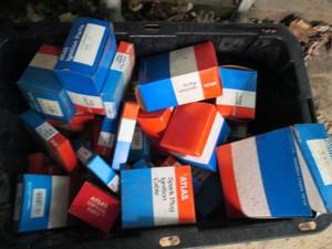 Heavy Duty Storage Tote full of assorted Atlas Ignition parts and spark plugs