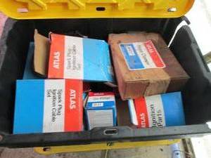 Heavy Duty Storage Tote with assorted Atlas Ignition parts, hose clamps and plug wires,