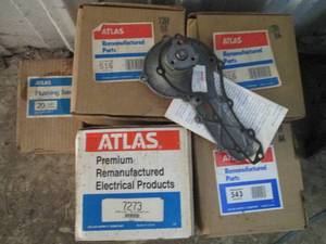 Heavy Duty Storage Tote with assorted Atlas alternators and flushing tees