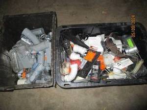 Covered tote of PVC plumbing fittings