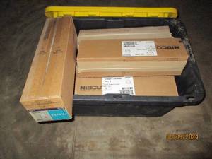Covered tote of PVC plumbing fittings