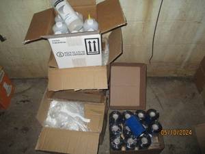 Bottles of Videojet and rolls of plastic