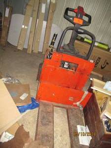 Ride on pallet jack, no batteries included, untested. Sold as is where is, bring help to load on ground level loading door or loading dock.