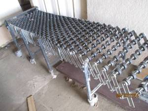 Expandable loading dock conveyor...