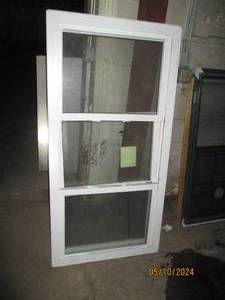 Double pane vinyl trimmed window...