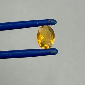 0.66 Carat Orange Stone Oval Faceted Cut