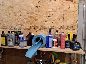 lot 219 image: Lot of  Assorted Automotive Chemicals - STP Fuel Injector Cleaner, Heet, Brake Parts Cleaner, Various Motor Oils, Air Filter, Roll Shop Towels
