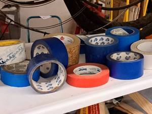 lot 427 image: Lot of (12) Assorted Rolls of Tape - Tyvec, Blue Painters, White and Orange