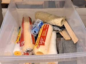 lot 428 image: Lot of  Painting Supplies with Tote - Assorted Roller Covers, Sanding Blocks, Stir Sticks