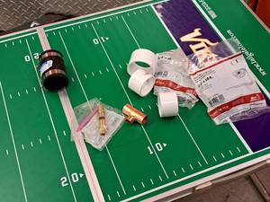 lot 451 image: Lot of (9) Assorted Plumbing Connectors - PVC Pipe, Copper T, PlumbQwik 1-12x1-12 Sewer and Drain, Galvanized Hanger Strap 34x10