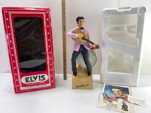 lot 73 image: 1977 ELVIS DECANTER WITHE MUSIC BOX A SECOND IN A SERIES MCCORMICK DISTILLING