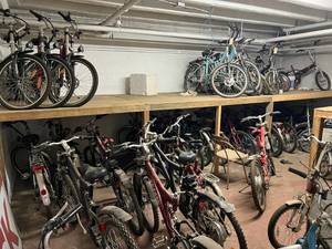 lot 750 image: LOOK - Room Full of 48 Electric Bikes - Full Size, Foldable & 3 Wheel Bikes, Batteries, Chargers, & Lots of Parts