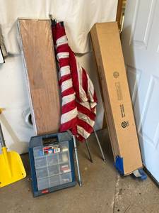 lot 845 image: Everything Inside Closet - US Flags, Rubbermaid Organizer, Flooring & More