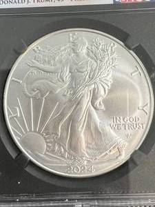 lot 03 image: 2024 AMERICAN SILVER EAGLE NGC MS70 DONALD TRUMP EDITION