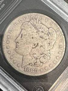lot 09 image: 1880 US MORGAN SILVER DOLLAR VG COLLECTORS EDITION