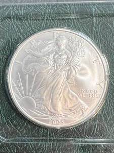 lot 96 image: 2005 AMERICAN SILVER EAGLE 1 TROY OZ .999 FINE SILVER IN INFO. CASE