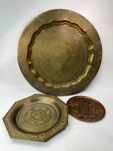 lot 55 image: Two Middle Eastern Brass Tray Table Wall Hangings and Copper Plate