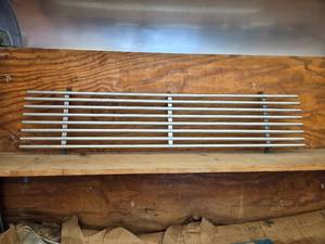 lot 8 image: Grill from a Square Body Chevy, Year Unknown