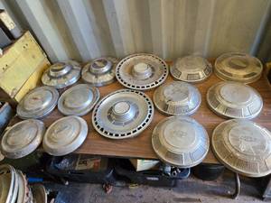 lot 64 image: Large Lot of Vintage Chevy Hub Caps