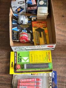 lot 242 image: Oil Filters, Auto or Boat Compasses