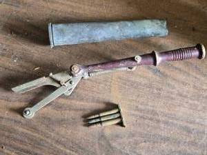 lot 256 image: Dented 40 MM Shell Casing, Old Clay Pigeon Thrower