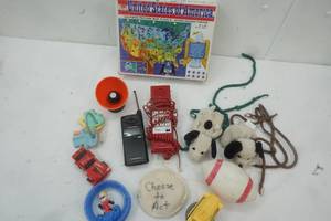 lot 86 image: Kid Toys, USA 100 Piece Puzzle, baby keys, Motorola flip phone and a red landline phone